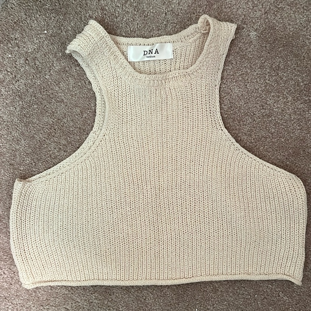 Cream cropped sweater material. Cute for fall/ winter activities with friends.